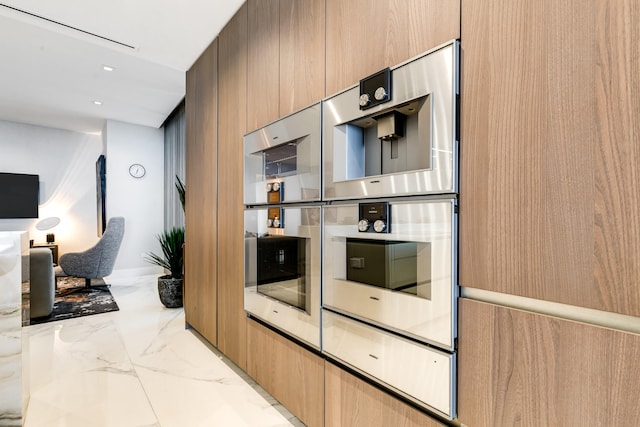 kitchen with light stone countertops and light tile floors