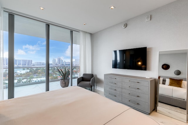 bedroom with access to outside and floor to ceiling windows