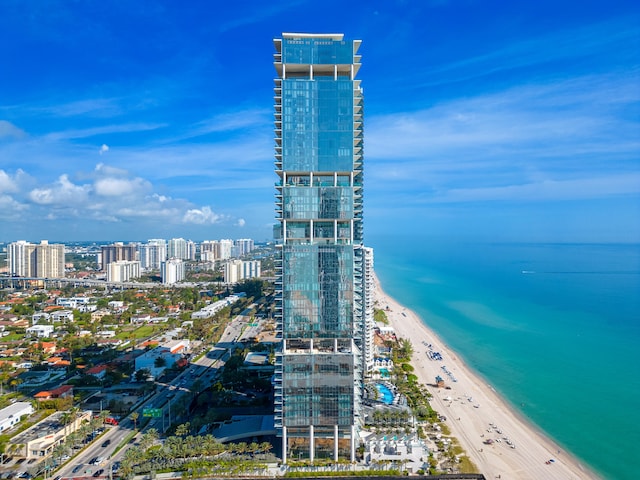 aerial view featuring a water view and a view of the beach