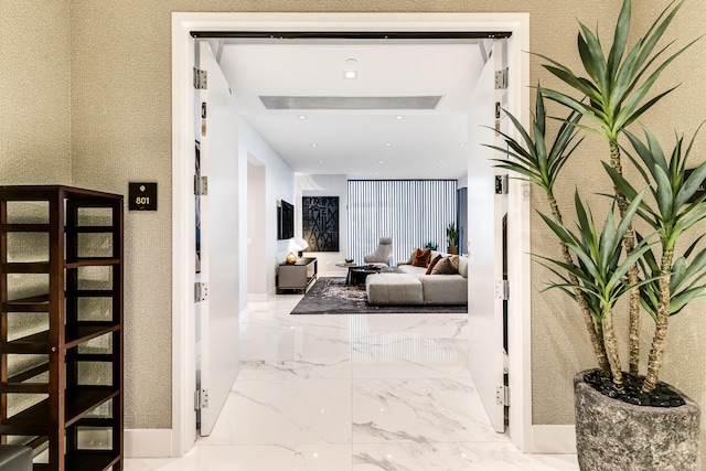 hall with light tile flooring