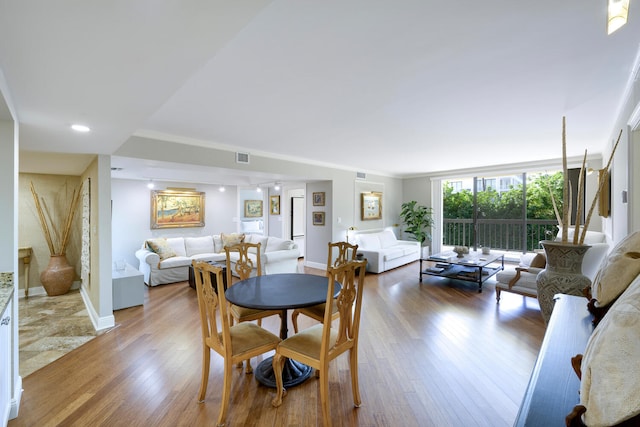 dining area with wood-type flooring