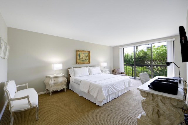 carpeted bedroom featuring access to outside