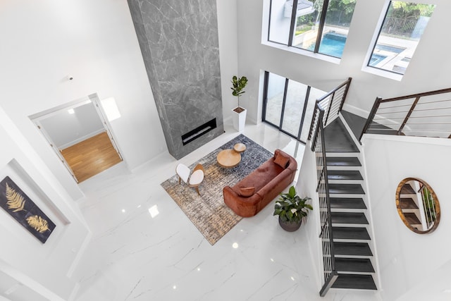 living room with a tiled fireplace