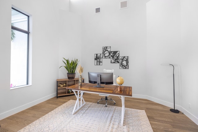 office space with light hardwood / wood-style flooring