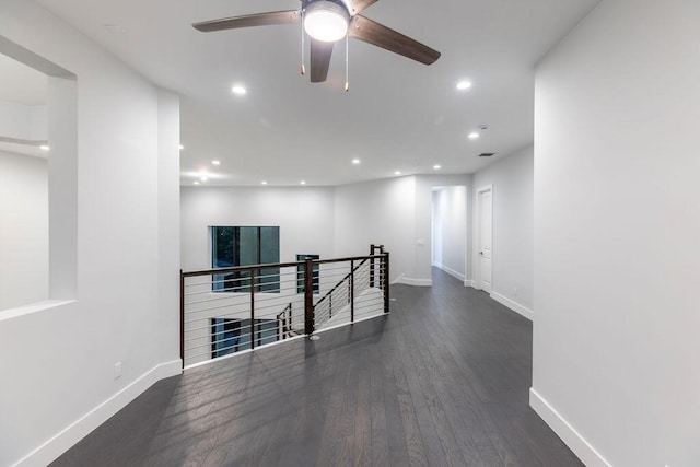 hallway with dark wood-type flooring