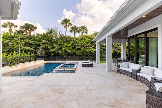 view of pool with an in ground hot tub, an outdoor hangout area, and a patio area