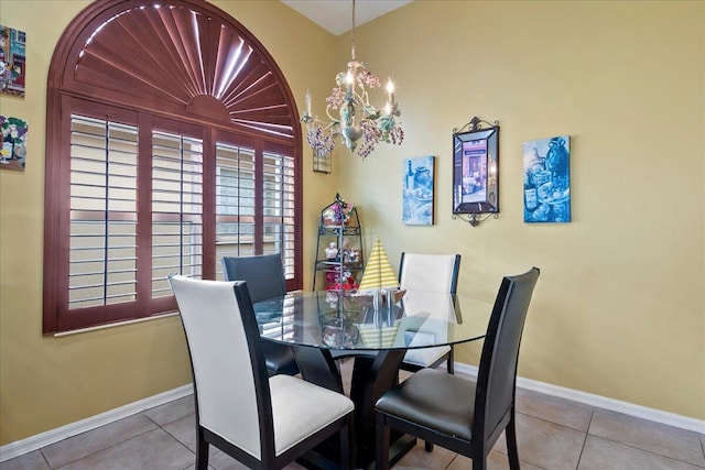 tiled dining area with a chandelier