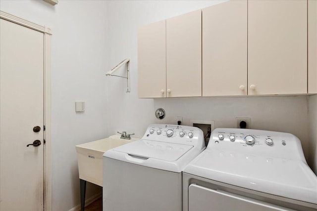 laundry area featuring hookup for a washing machine, hookup for an electric dryer, separate washer and dryer, and cabinets