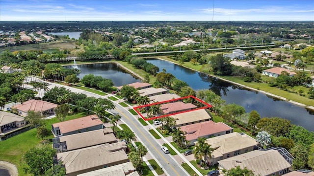 8839 Via Avellino, Lake Worth, FL 33467 - aerial view of residential area featuring property boundaries highlighted and a nearby body of water