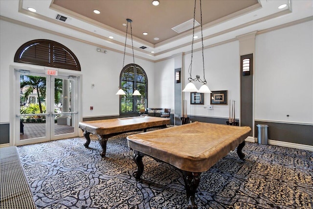 game room with a raised ceiling, french doors, billiards, and a towering ceiling