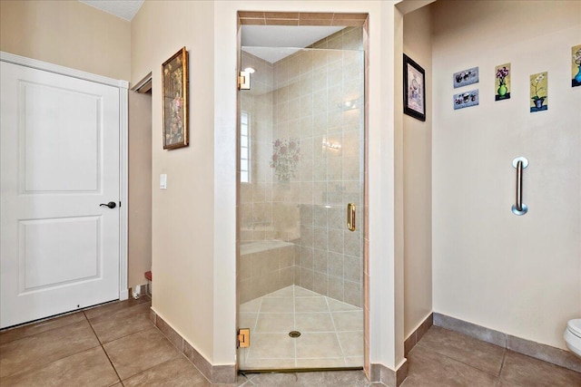 8839 Via Avellino, Lake Worth, FL 33467 - full bath featuring a shower stall, baseboards, tile patterned flooring, and toilet