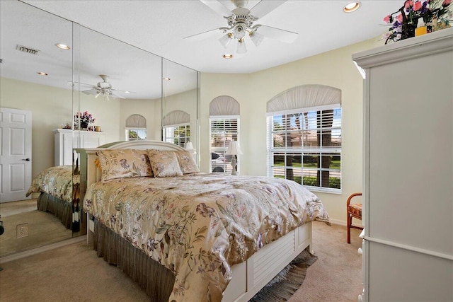 8839 Via Avellino, Lake Worth, FL 33467 - bedroom featuring light colored carpet, multiple windows, recessed lighting, and ceiling fan