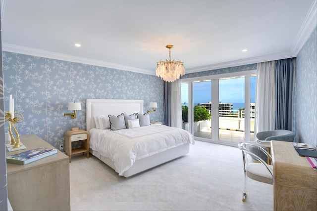 carpeted bedroom featuring ornamental molding, an inviting chandelier, access to exterior, and a water view