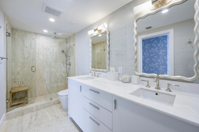 bathroom featuring walk in shower, dual vanity, toilet, and tile floors