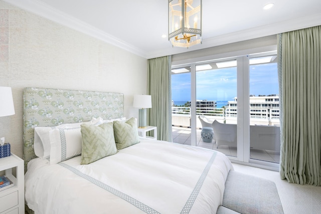 carpeted bedroom featuring ornamental molding, access to outside, and a water view