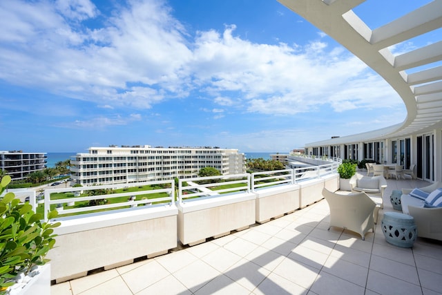 balcony featuring a water view