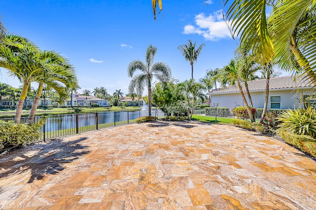 view of patio with a water view