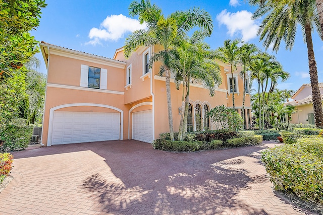 mediterranean / spanish-style home featuring a garage