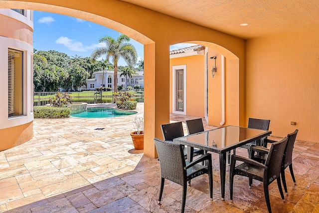 view of patio featuring a fenced in pool