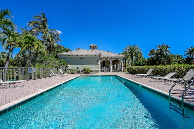 view of swimming pool with a patio area