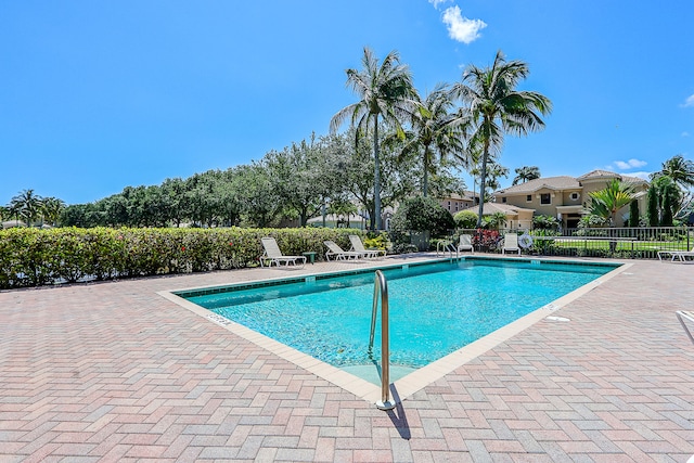 view of swimming pool with a patio