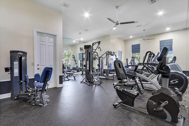 gym featuring ceiling fan and plenty of natural light