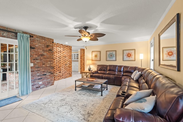 tiled living room featuring brick wall, ceiling fan, and ornamental molding