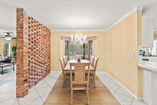 dining space with a textured ceiling, ceiling fan with notable chandelier, and light tile patterned floors