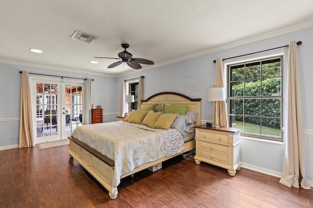 bedroom with ceiling fan, multiple windows, access to exterior, and hardwood / wood-style flooring