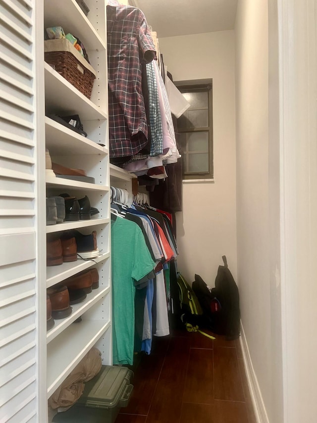 walk in closet featuring dark wood-type flooring