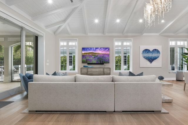 living room featuring vaulted ceiling with beams, light hardwood / wood-style floors, wood ceiling, and a chandelier