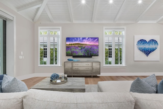 living room featuring vaulted ceiling with beams, light wood-type flooring, and wooden ceiling