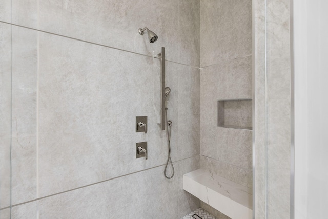 bathroom featuring tiled shower