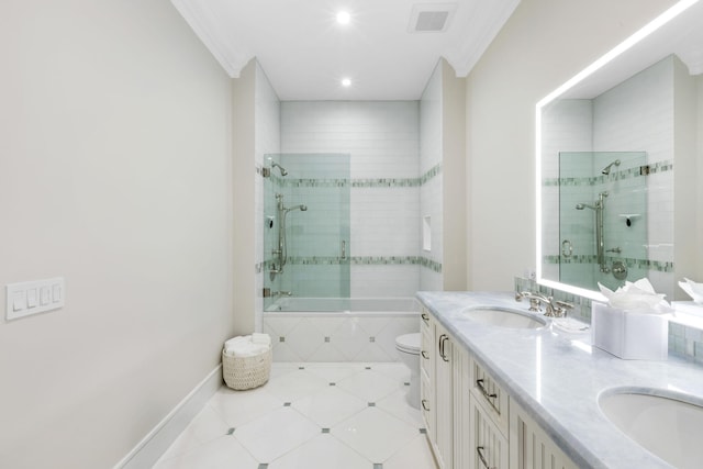 full bathroom with vanity, tiled shower / bath combo, tile patterned flooring, crown molding, and toilet