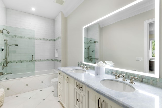 full bathroom featuring vanity, tile patterned flooring, tiled shower / bath, and toilet