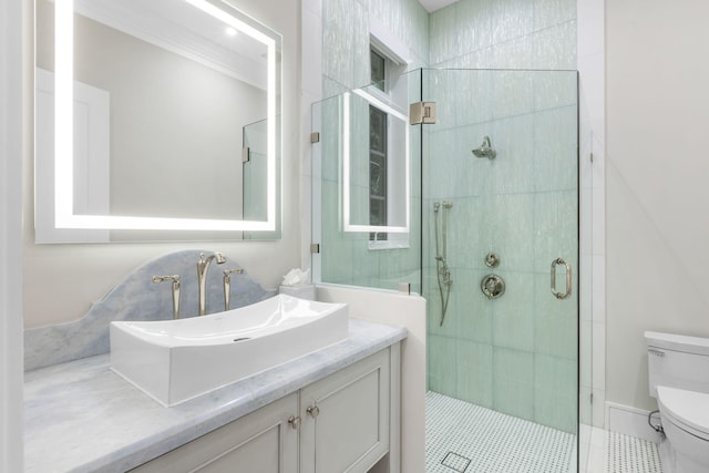 bathroom with walk in shower, tile patterned floors, ornamental molding, vanity, and toilet