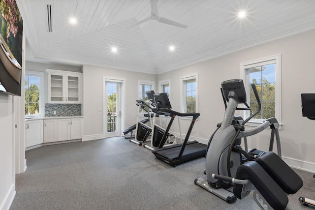 workout room with a wealth of natural light, vaulted ceiling, ceiling fan, and wooden ceiling