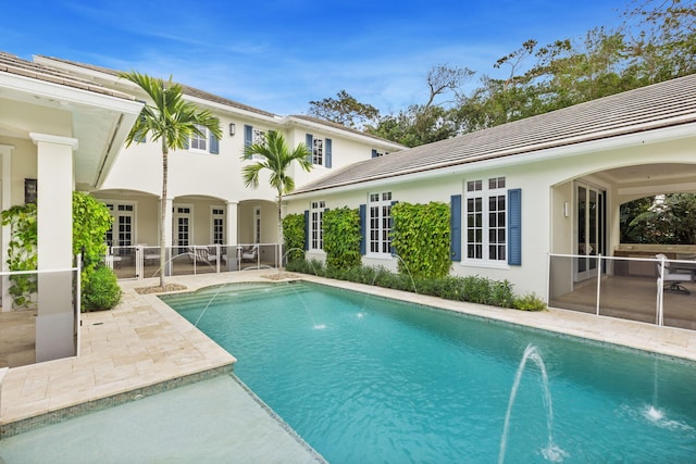 view of pool featuring a patio area and pool water feature