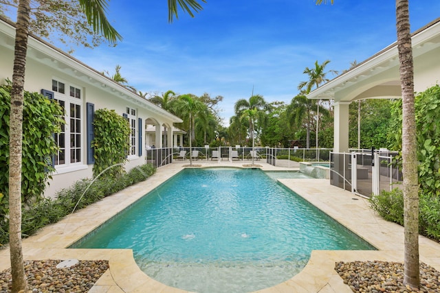 view of pool with pool water feature and a patio area