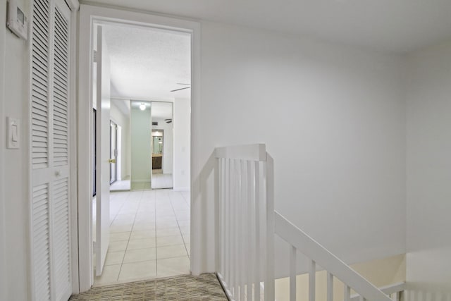 corridor with light tile patterned floors