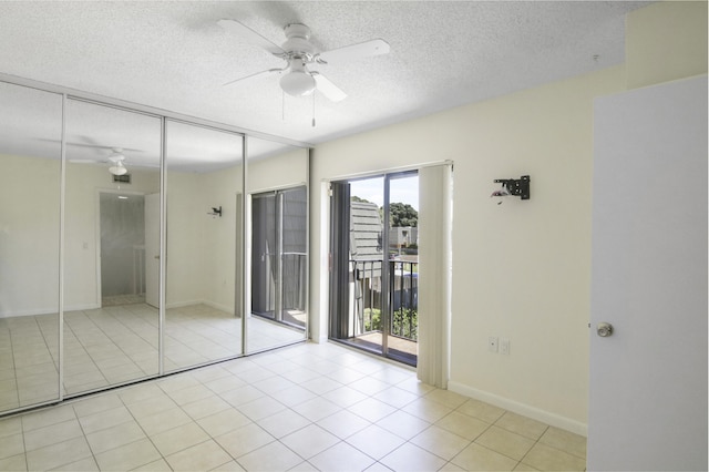 unfurnished bedroom with light tile patterned floors, a textured ceiling, access to outside, ceiling fan, and a closet