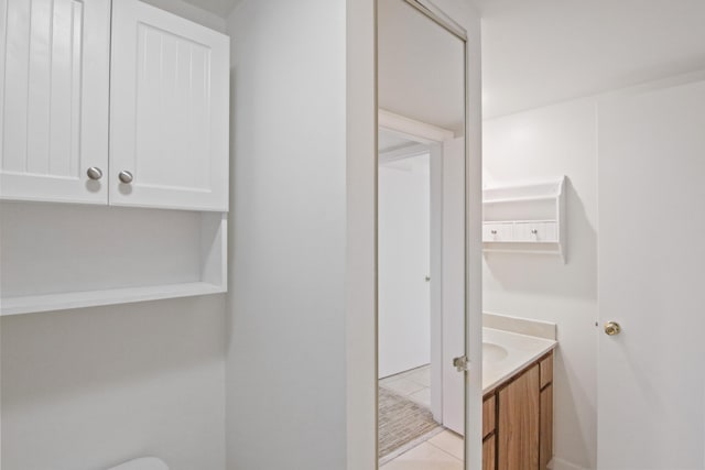 bathroom with vanity and tile patterned flooring