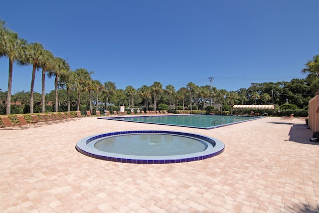 view of swimming pool featuring a patio area