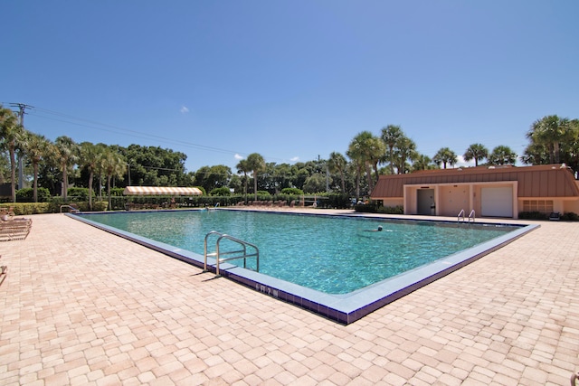 view of pool featuring a patio area