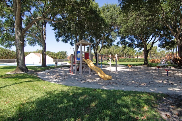 view of jungle gym featuring a lawn