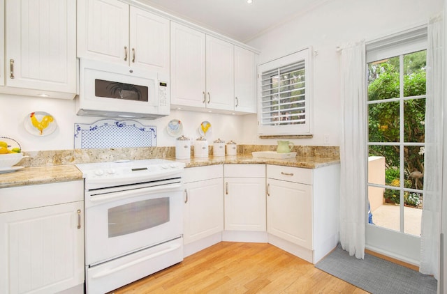 kitchen featuring light hardwood / wood-style floors, white appliances, white cabinetry, and light stone counters