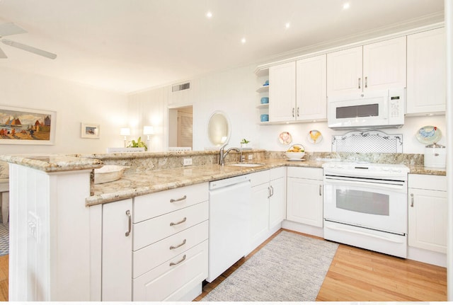 kitchen with kitchen peninsula, white cabinetry, ceiling fan, white appliances, and light wood-type flooring