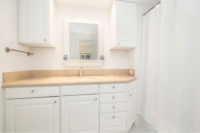 bathroom featuring vanity and ornamental molding