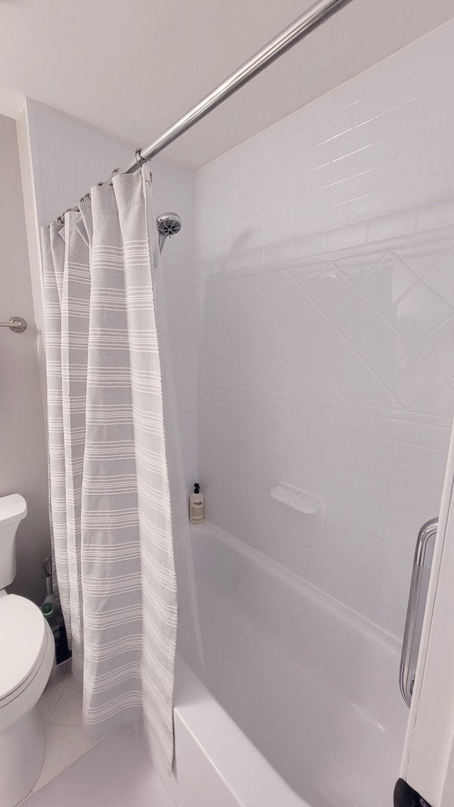 bathroom with shower / bath combo with shower curtain, tile patterned floors, and toilet