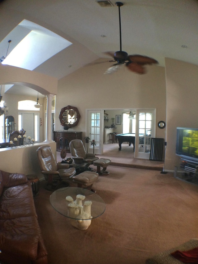 carpeted living room with high vaulted ceiling, ceiling fan, and pool table